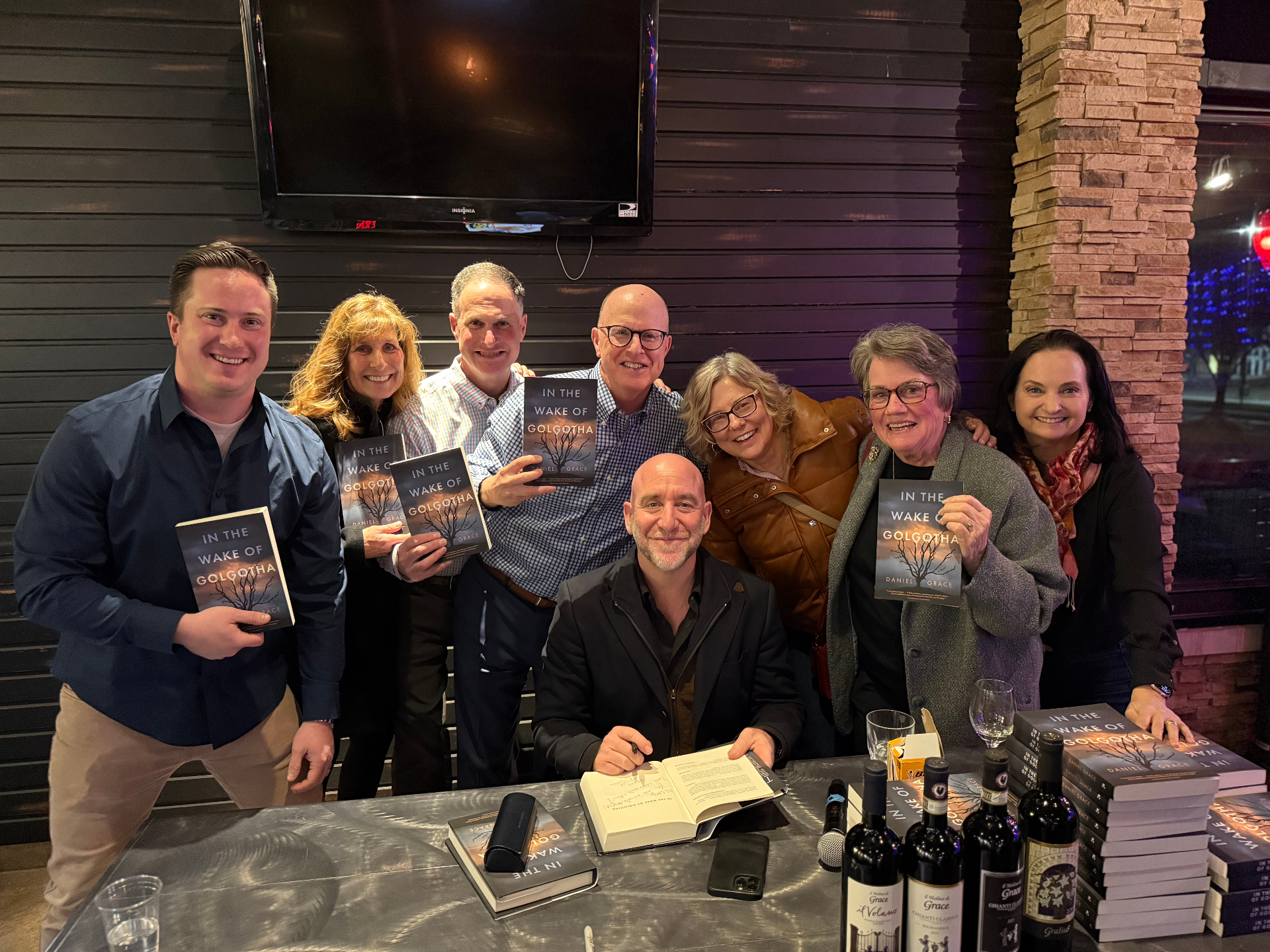 Group of readers with signed copies at Beau's Grille book signing