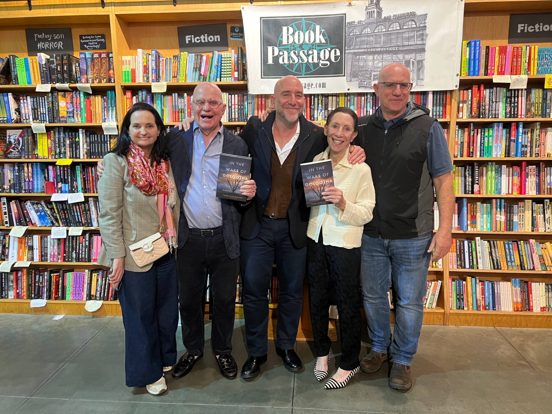 Daniel Grace with readers holding In the Wake of Golgotha at Book Passage