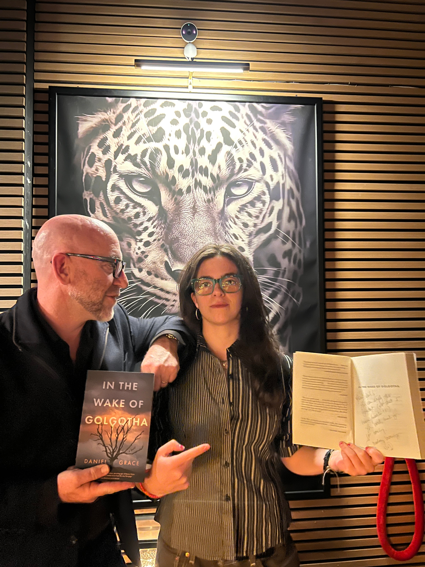 Daniel Grace with reader holding a signed copy at Sullaluna NYC Bookshop + Bistrot