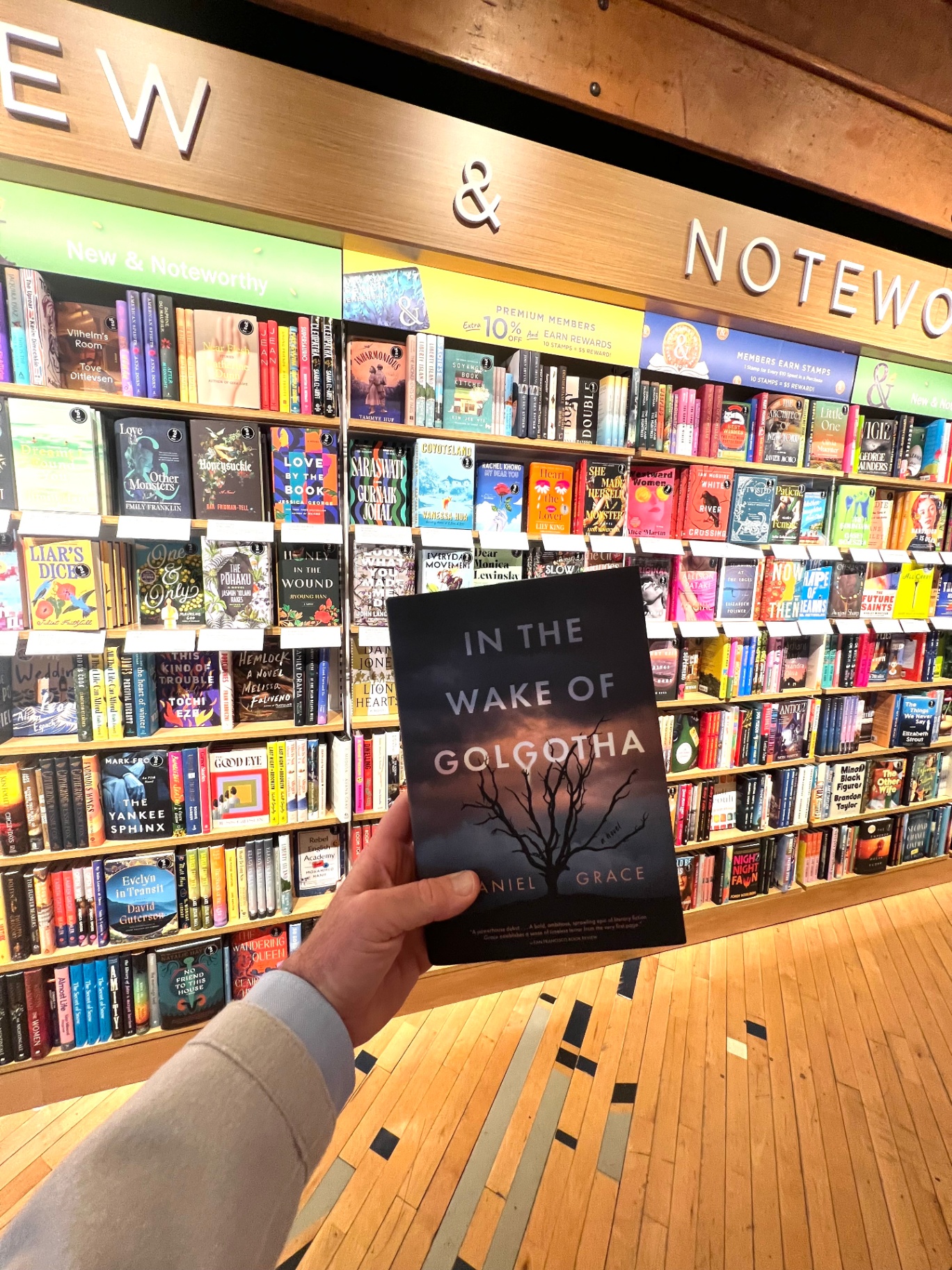 In the Wake of Golgotha held in front of the New & Noteworthy display