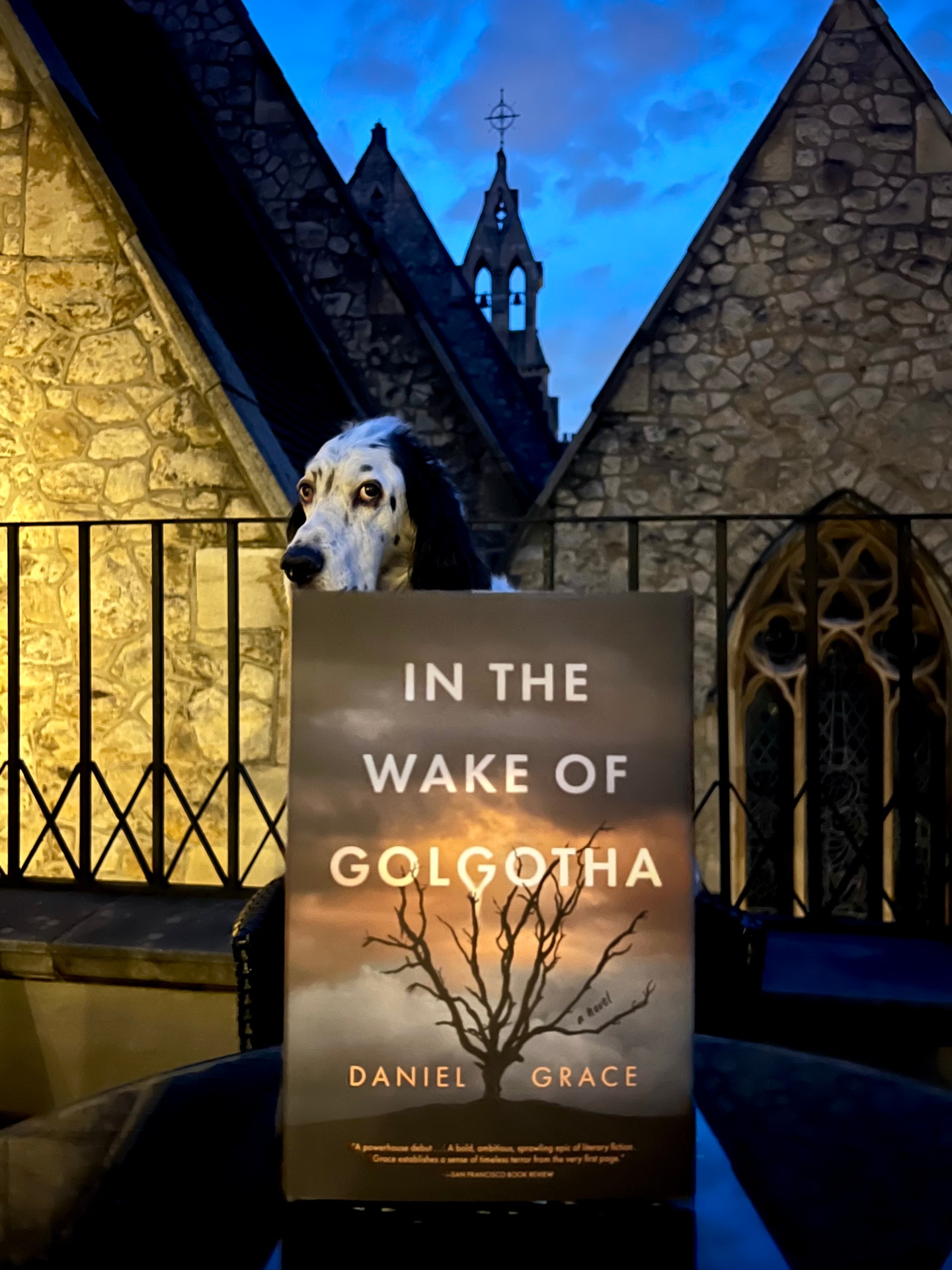 In the Wake of Golgotha held by a setter at dusk before a stone church